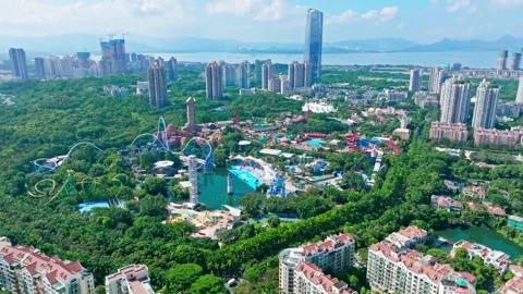 Roller coaster loops and turquoise pools - Shenzhen Stock Footage 346612866