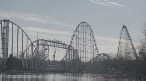 Roller Coaster (not running) and pond with geese - 4K Stock Footage 61941371