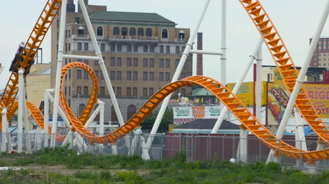 Roller Coaster Panning Shot at Coney Island New York During the Summer Video stock 63660835