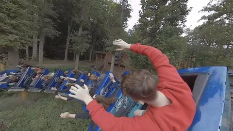 Roller coaster POV shot at fairground in forest Video stock 118256541