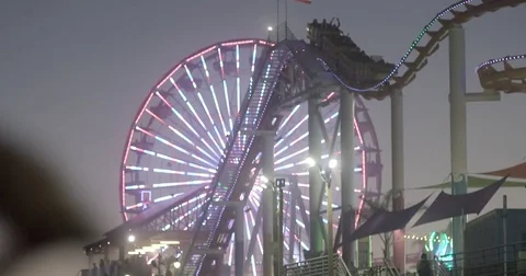 Roller Coaster Ride In Amusement Park At Night Stock Footage 76485406