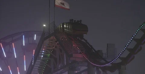 Roller Coaster Ride In Amusement Park At Night 3 Video stock 76485923