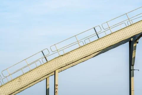 Roller coaster ride with a blue cloudy sky in the background Stock Photos