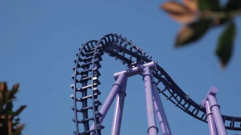 Roller Coaster Ride on Bright Blue Sky Background Stock Footage 155395241