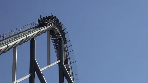 Roller coaster ride fall and camera follows on an amusement park Video stock 69734064