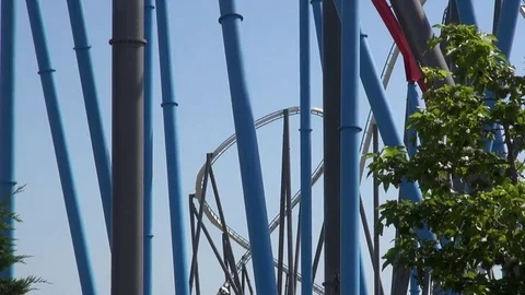 Roller coaster ride loop and pillars on an amusement park Video stock 69733956