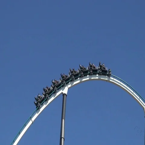 Roller coaster ride rise and fall on an amusement park Vídeos de archivo 69733807