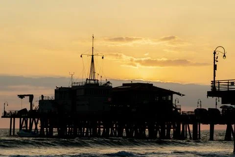 Roller Coaster Silhouette Glows at Sunset Along California Coast Stock Photos