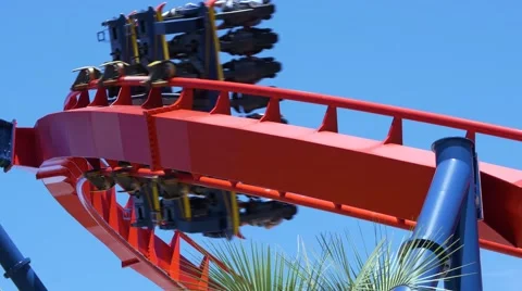 Roller coaster speeds through frame on sharp turn Stock Footage 62067355