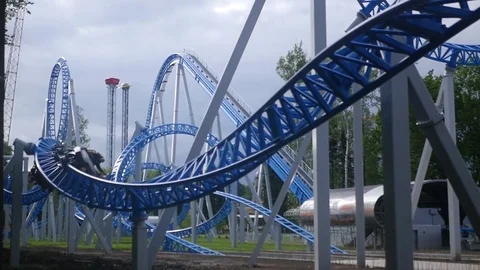 Roller coaster in the summer in the park slow motion. 1920x1080. full hd Stock Footage 79238777