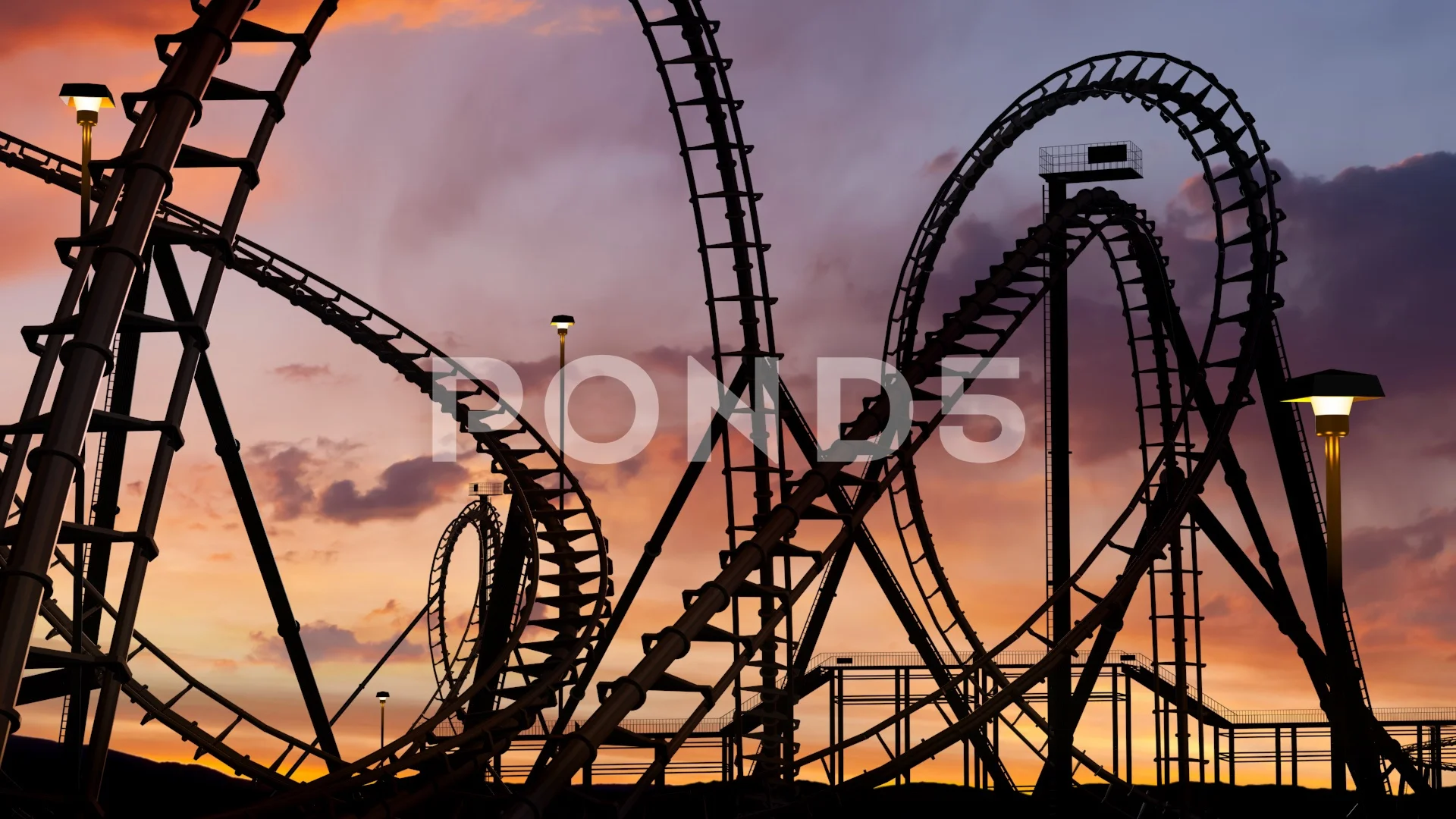 roller coaster thrill ride at amusement park at sunset with car