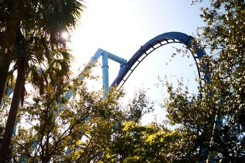 Roller Coaster Track Above Trees In Bright Sunlight Stock Photos