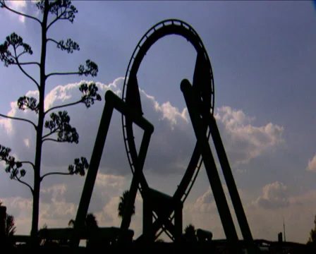 A roller-coaster track loop as the roller-coaster cart loops round the track Stock Footage 36423179