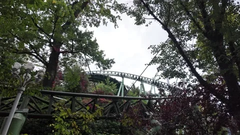 Roller Coaster Track Winding Through Mature Trees at Liseberg Gothenburg 스톡 동영상 347681311