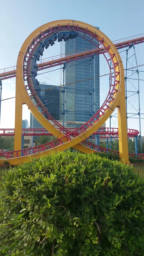 Roller coaster train completing a vertical loop at Central Park in Ulaanbaatar Stock Footage 344371654