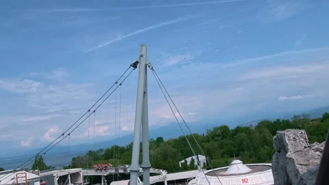 Roller coaster train at Gardaland climbs a steep slope Stock Footage 336388752
