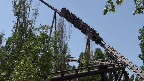 Roller coaster vertical loop ride at amusement park Stock Footage 280693943