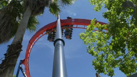 Roller Coaster Whips Around Tall Loop, 4K Stock Footage 62067217