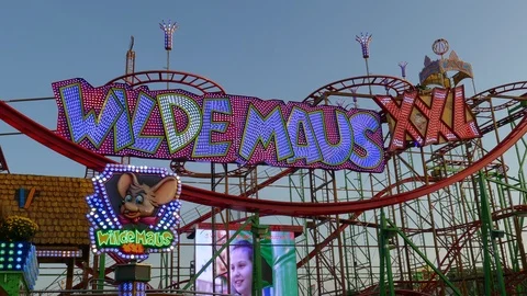 Roller Coaster Wilde Maus XXL on the fair Bremer Freimarkt at dusk, Bremen Stock Footage 120123701
