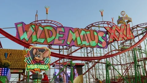 Roller Coaster Wilde Maus XXL on the fair Bremer Freimarkt at dusk Stock Footage 120123832