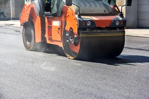Roller compactor working Stock Photos