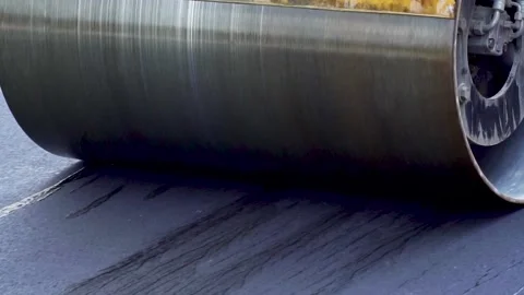 Roller compacts the new asphalt Stock Footage 237055668