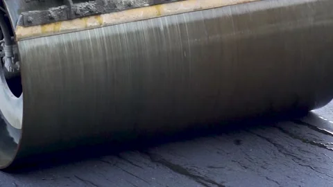 Roller compacts the new asphalt Stockbeeldmateriaal 237055669