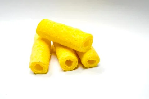 Roller of corn and corn snack on white background Stock Photos