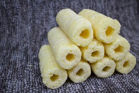 Roller corn snack, snack from corn product Stock Photos