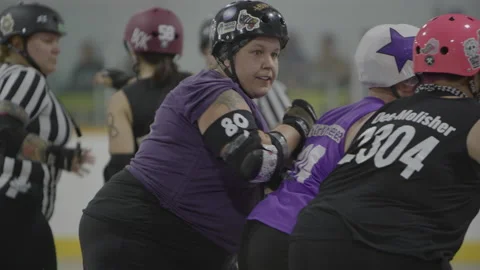 Roller derby girls practicing in an arena Stockbeeldmateriaal 232536859