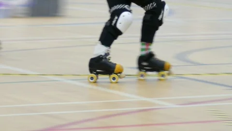 Roller derby. Single skater moving past camera Stock Footage 86605003