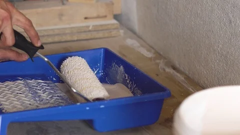 The roller dip into the paint Stock Footage 83337216