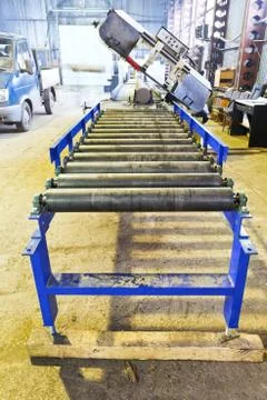 Roller feeder of cutting saw machine Stock Photos