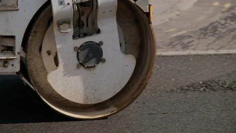Roller flattening new road surface Stock Footage 171865176