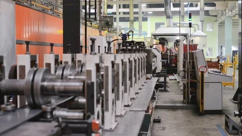Roller forming machine. The interior of the plant producing a metal profile. Stock Footage 101865684