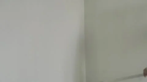 Roller painter in action on a white wall Stock Footage 68799866