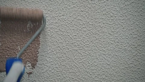 Roller painting of a structural surface Stock Footage 323560630