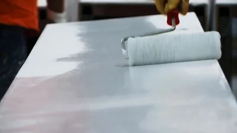 Roller painting with white paint Stock Footage 128929243