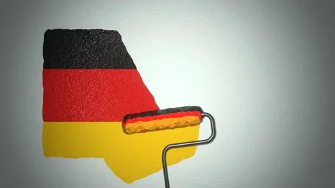 Roller paints the wall in colors of German flag. Travel concept.	 Stock Footage 168486907