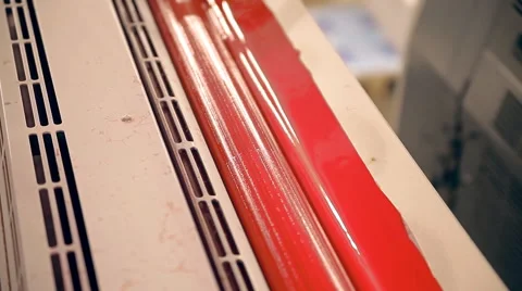 A roller with red ink is rotating in the printing Stock Footage 61250613