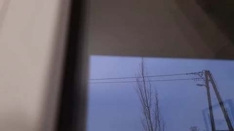 Roller shutter curtains mounted on a window are closing 库存影片 232591478