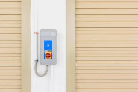 Roller shutter door and automatic door switch in new factory building for i.. Stock Photos