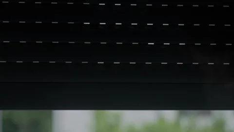 Roller shutter moves upward over residential window, revealing the view outside Stock Footage 340582656