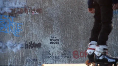 Roller Skater Doing a Trick in Concrete Skate Park Slow Motion Video stock 121007724
