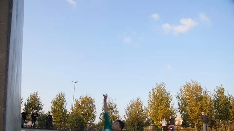 Roller Skater Doing a Trick in Concrete Skate Park Slow Motion Stock Footage 121008016