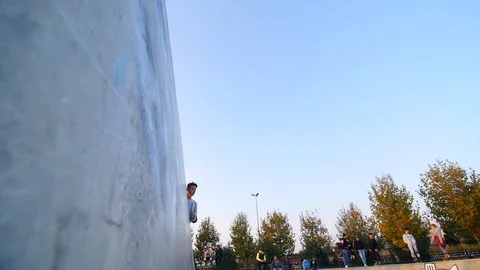 Roller Skater Doing a Trick in Concrete Skate Park Slow Motion Stock-Footage 121008146