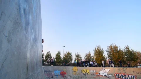 Roller Skater Doing a Trick in Concrete Skate Park Slow Motion Stock Footage 121008184