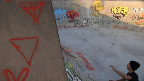 Roller Skater Doing a Trick in Concrete Skate Park Slow Motion Stock Footage 121008230