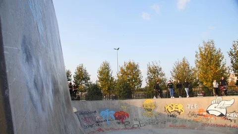 Roller Skater Doing a Trick in Concrete Skate Park Slow Motion Stock Footage 121008255