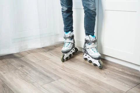 Roller skates and denim shorts on the home sofa. sports equipment 스톡 사진